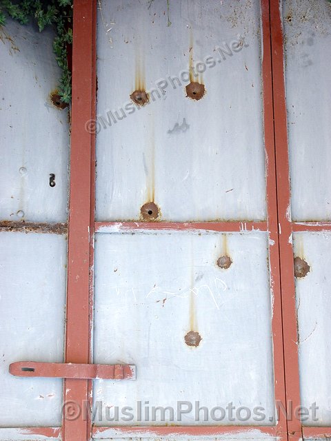 Bullet holes as a result of shooting from the occupants of Palestine