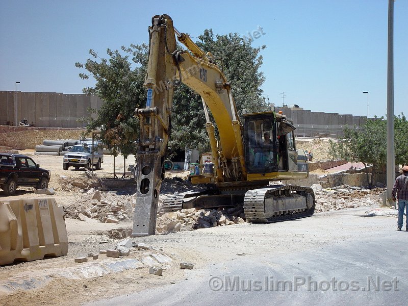 Working just in front of the apartheid wall